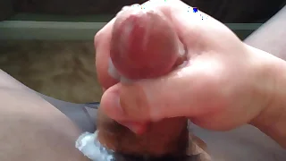 Jerking cumshot in seamless pantyhose